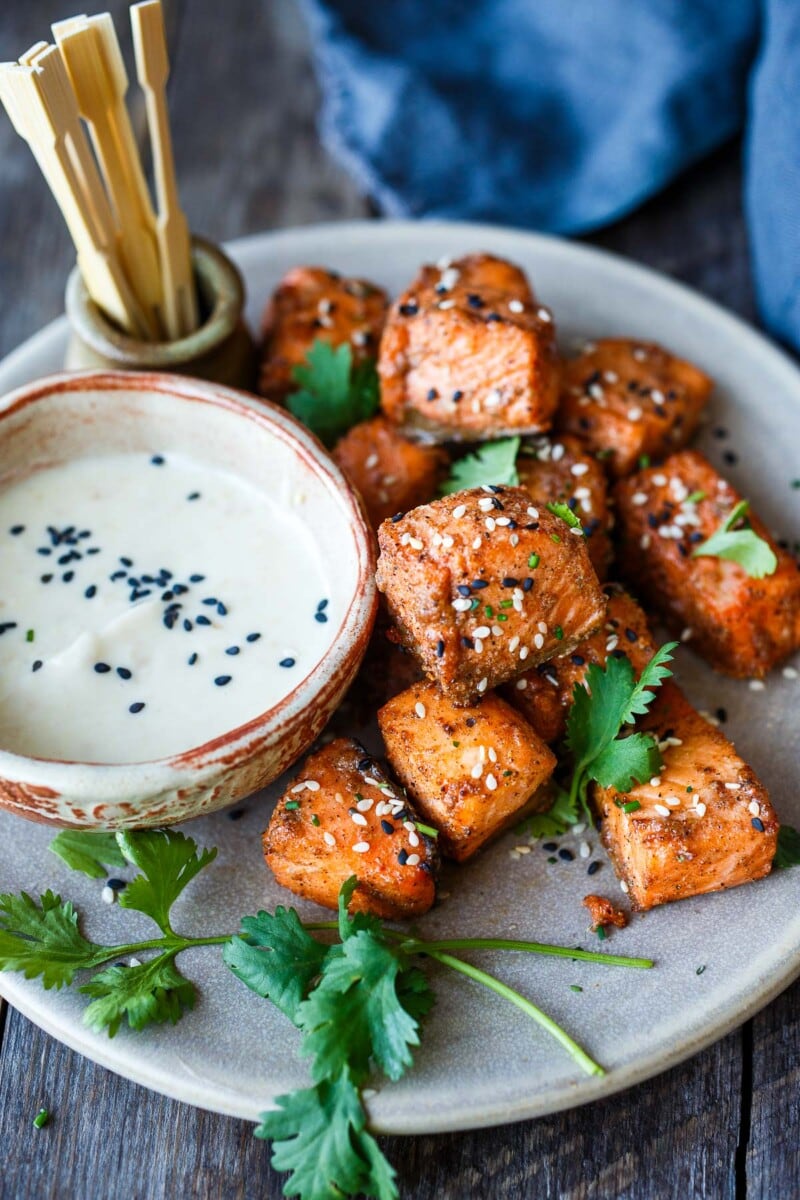 Succulent and flavorful, Air Fryer Salmon Bites are served with a miso ginger dipping sauce and ready in about 15 minutes! Perfect for appetizers, bowls, salads, and snacks! Gluten-free.