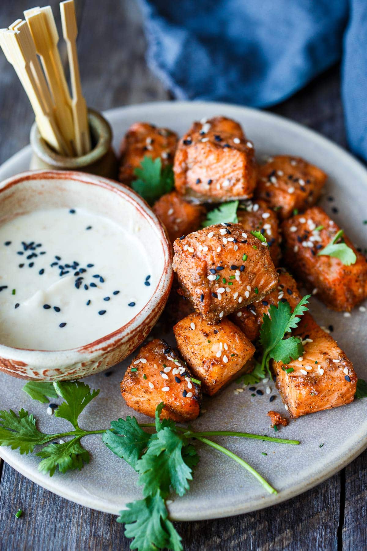 Succulent and flavorful, Air Fryer Salmon Bites are served with a miso ginger dipping sauce and ready in about 15 minutes! Perfect for appetizers, bowls, salads, and snacks! Gluten-free.