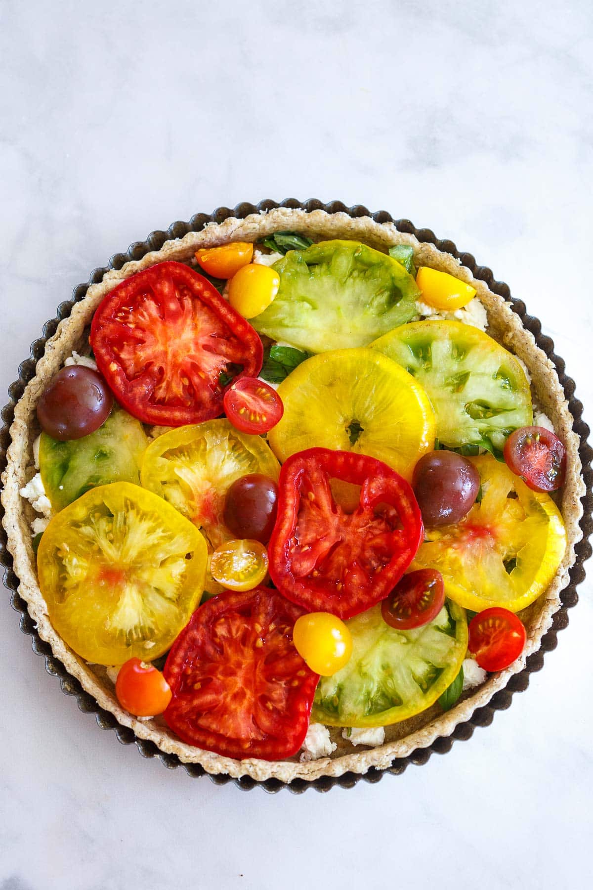 Fresh tomatoes in the tart crust for Tomato Tart.