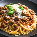 This Bolognese Sauce (aka Sunday Sauce) is hearty, robust and full of depth and flavor! Make it in a slow cooker, on the stovetop or in an Instant pot. We lighten it up with ground turkey (optional) and add mushrooms for extra umami.