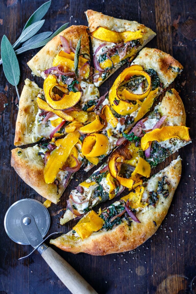 A delicious fall-inspired pizza topped with butternut squash ribbons, sage, caramelized onions, swiss chard and burrata cheese. Cozy fall flavors make the perfect bite!
