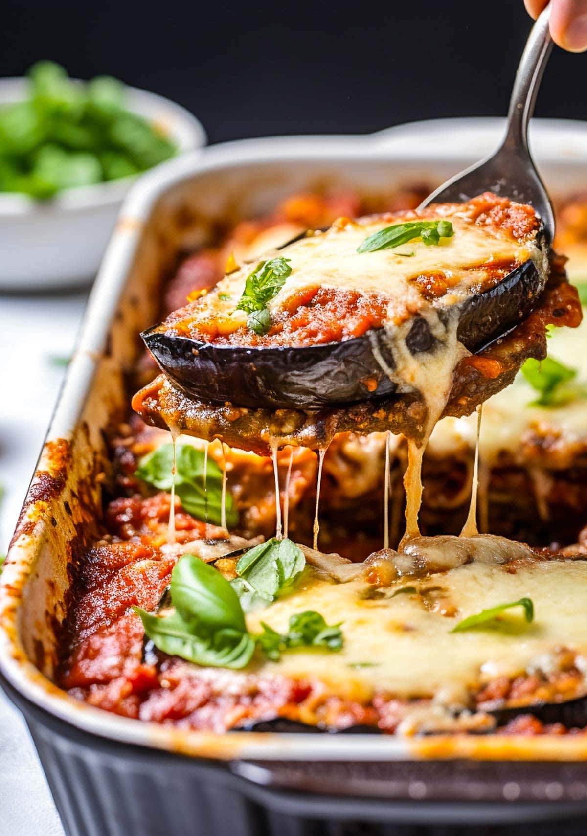 This Eggplant Parmesan recipe is made with layers of lightly breaded baked eggplant, flavorful marinara sauce, parmesan cheese and melty mozzarella. Robust and flavorful, this classic Italian dish is one your whole family will love.