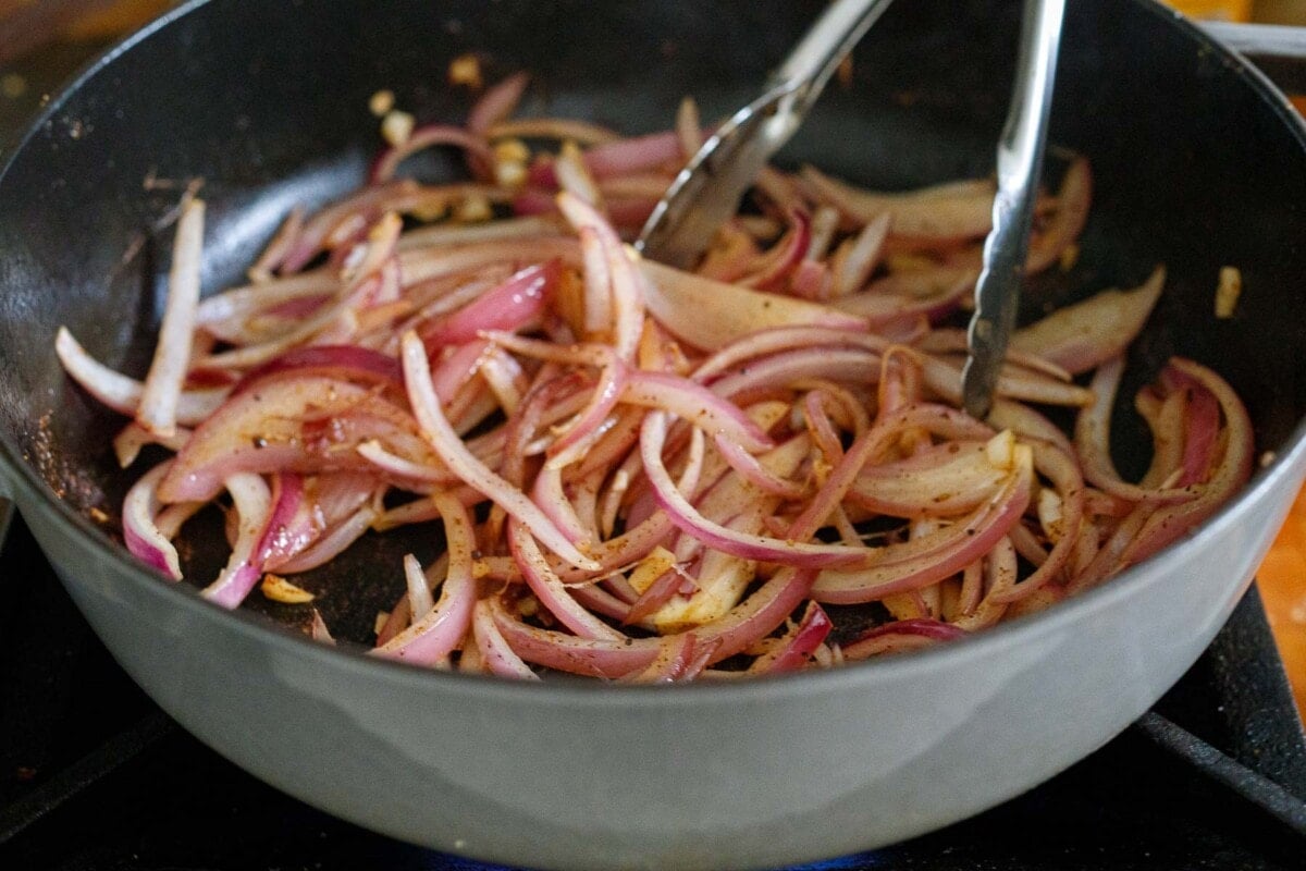 red onions sauteing in dutch oven