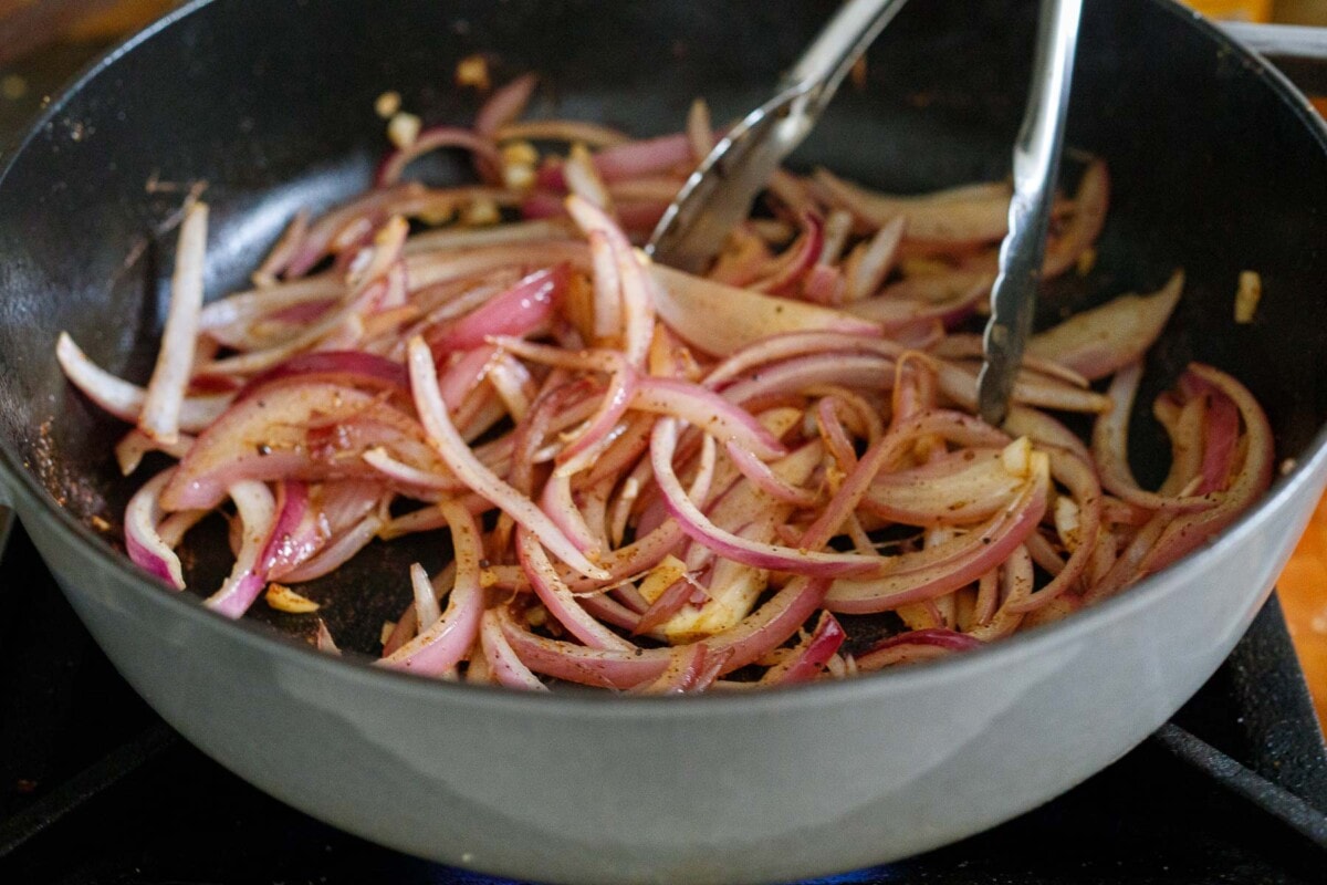 red onions sauteing in dutch oven