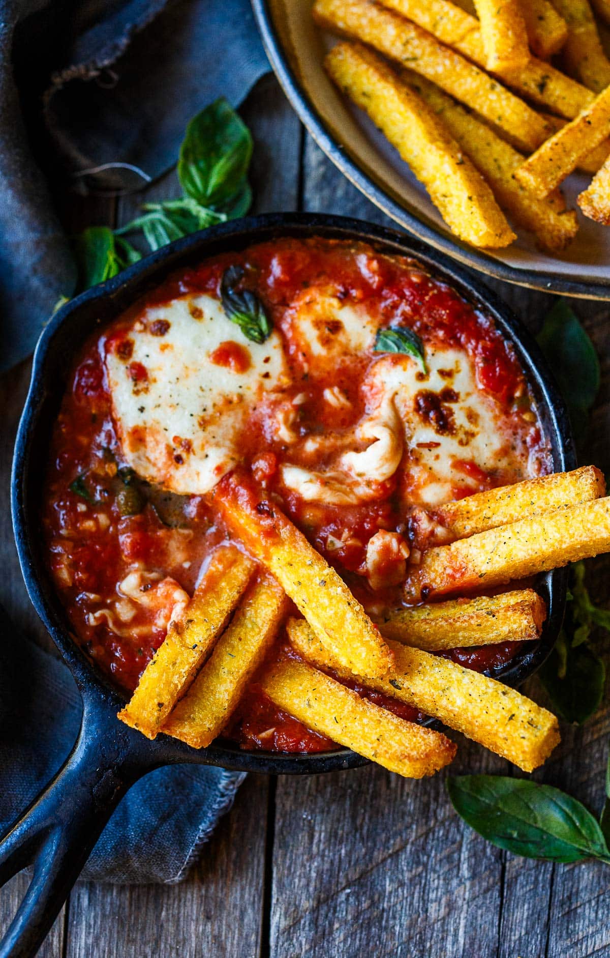 Polenta Fries with warm marinara sauce and melty cheese.