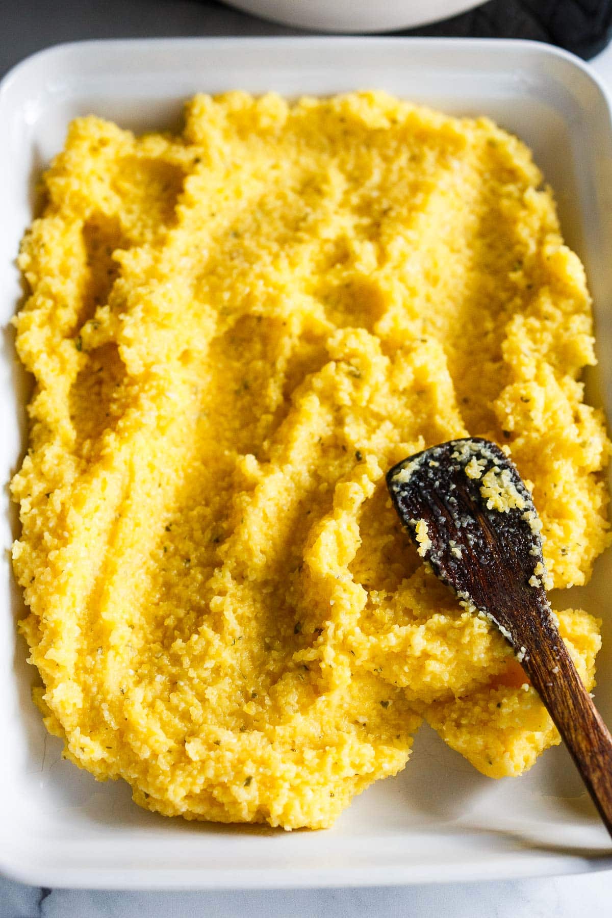 Spreading the polenta out on the pan.