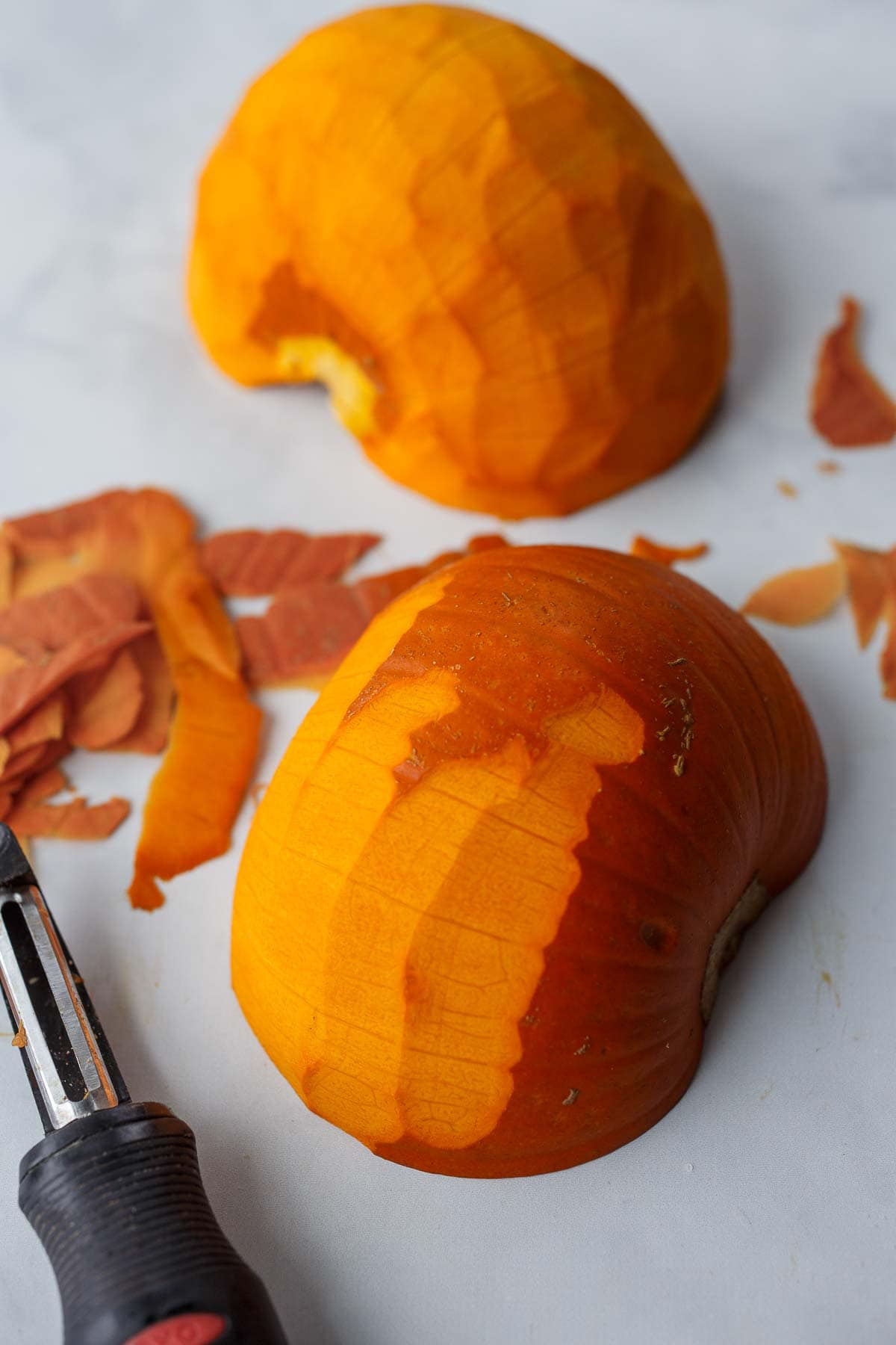 Peeling pumpkin for pumpkin curry.