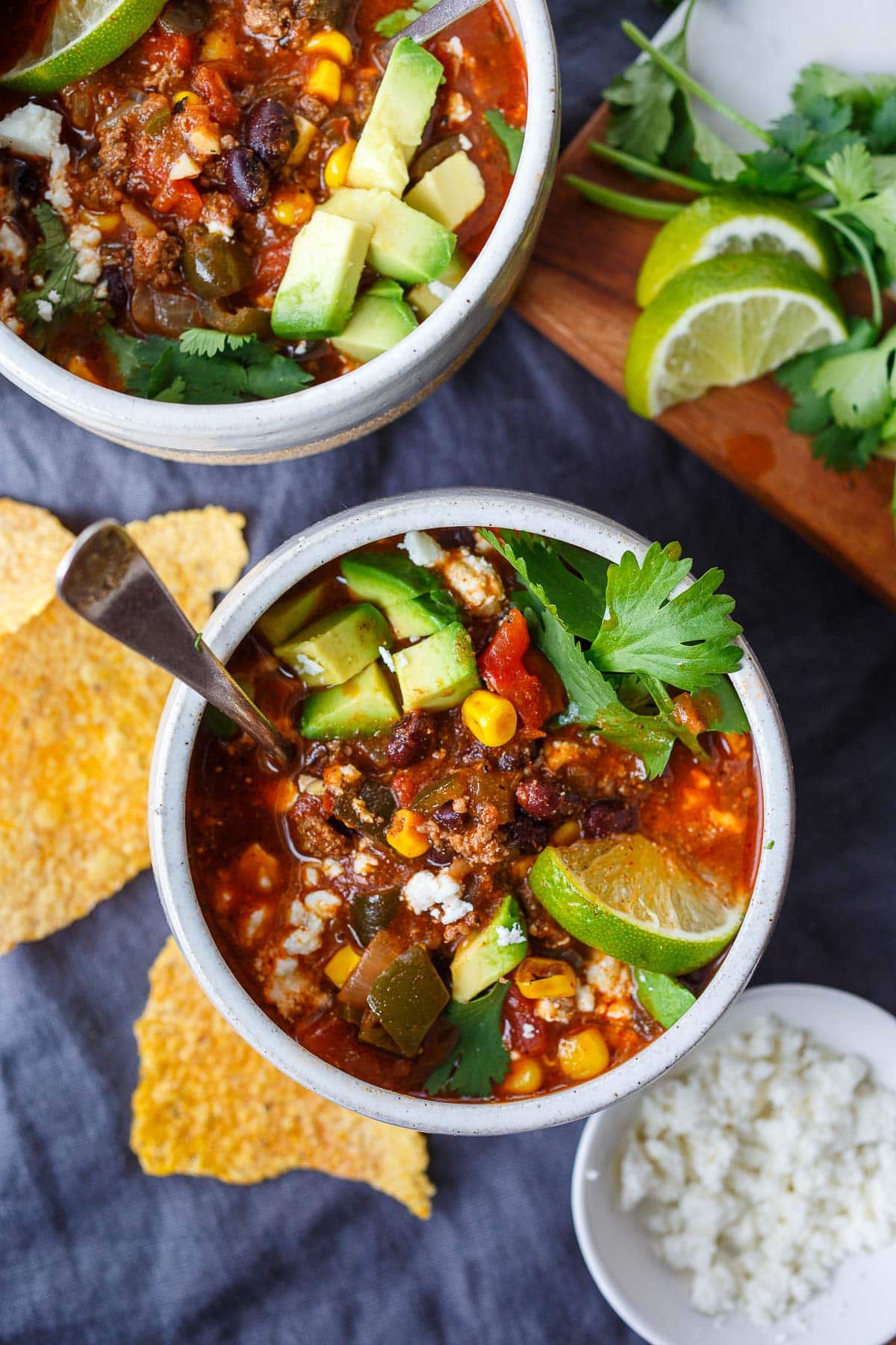 Taco soup in a bowl with avocado.