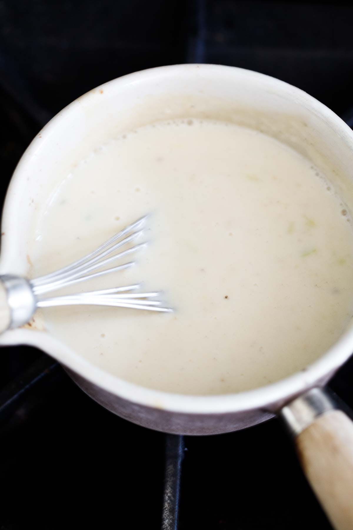 whisk in pot with roux