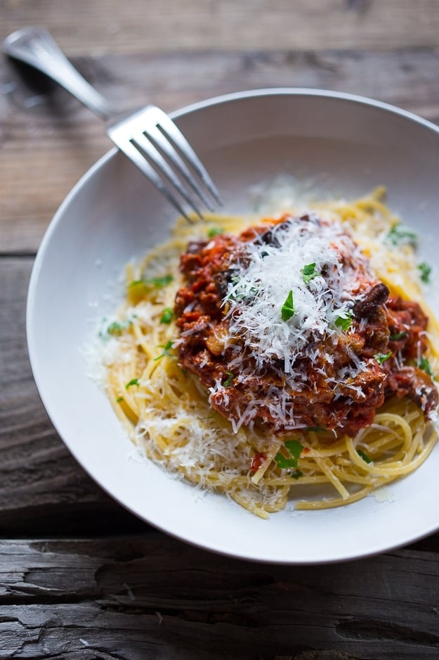 A simple, healthy recipe for Turkey Mushroom Bolognese, that can be made in an Instant Pot, Slow Cooker or stove top. Flavorful and delicious! | www.feastingathome.com