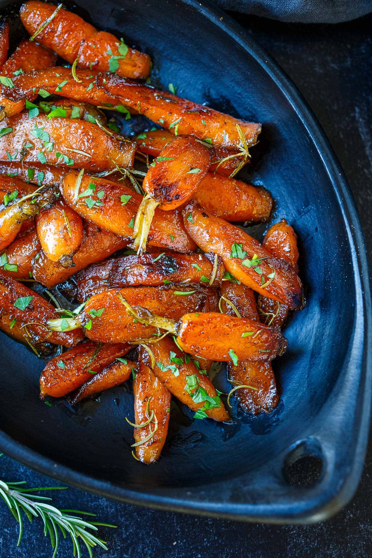 These simple Glazed Carrots are a delightful addition to any meal, tender and succulent with just the right balance of sweet and tangy. Special enough for the holiday table and easy enough for weeknight dinners. Vegan-adaptable.