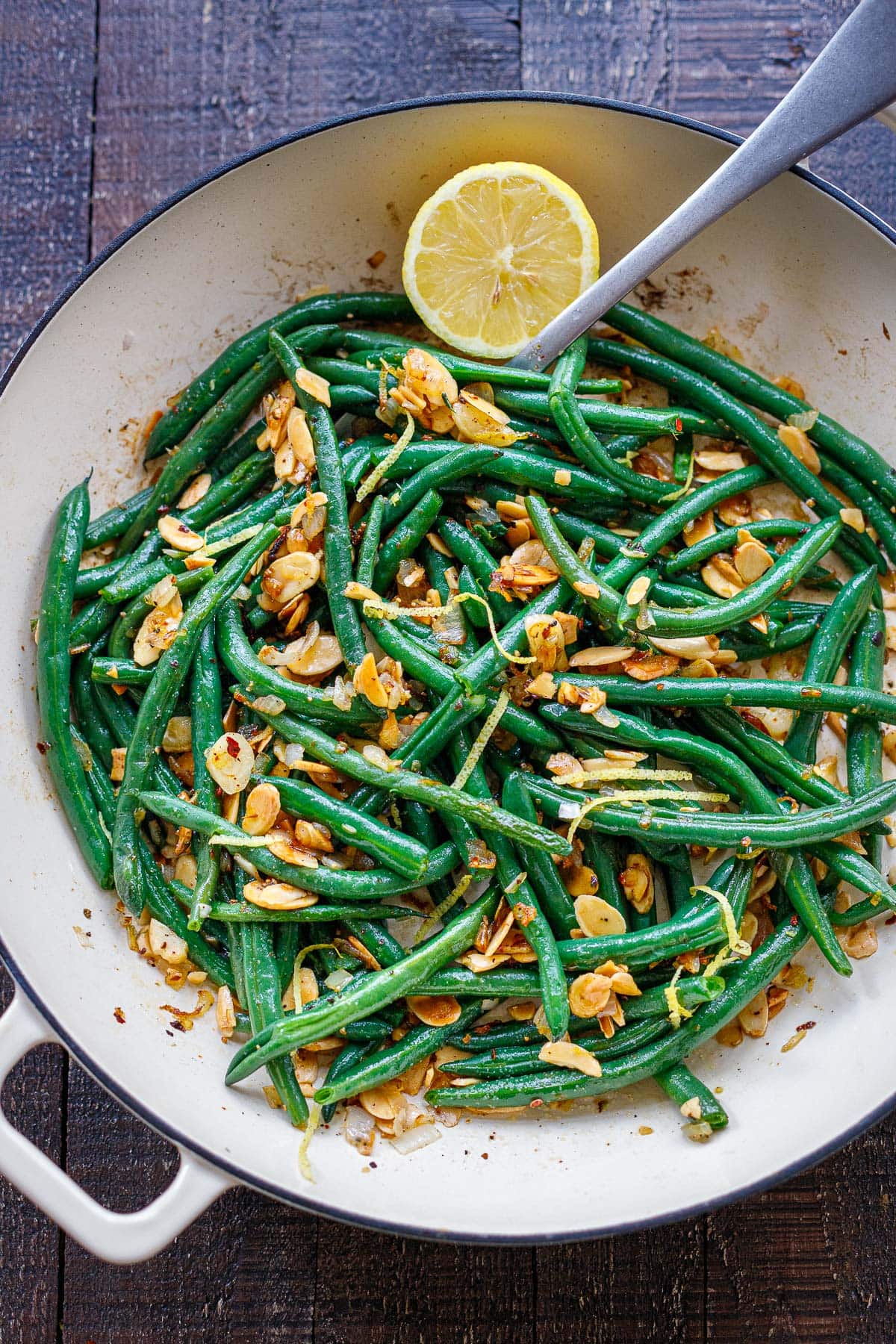 saute pan with green beans almondine, sliced almonds, lemon zest