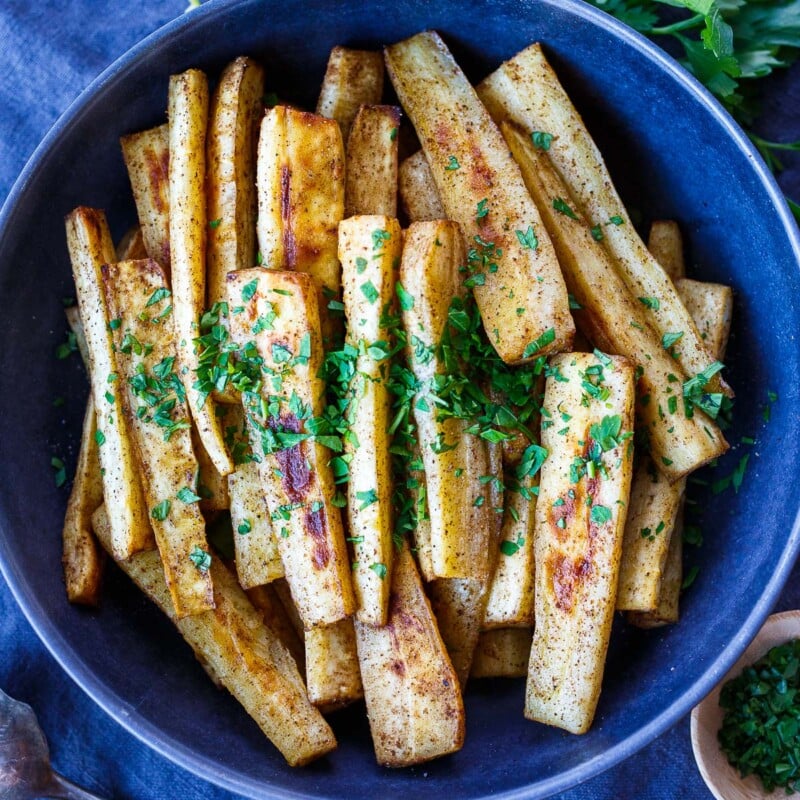 Roasted Parsnips are simple to make and packed with nutrients- a warm cozy side dish for weeknight dinners or a festive holiday spread.