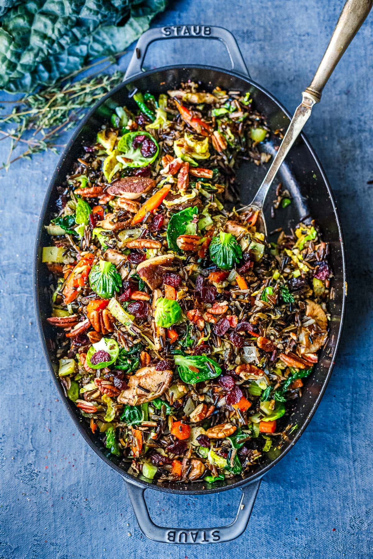 This Wild Rice Pilaf recipe is hearty, textural and savory. Nutty wild rice is paired with mushrooms, pecans, leeks, Brussels sprouts, and craisins. A lovely, colorful side dish that is vegan and gluten-free.