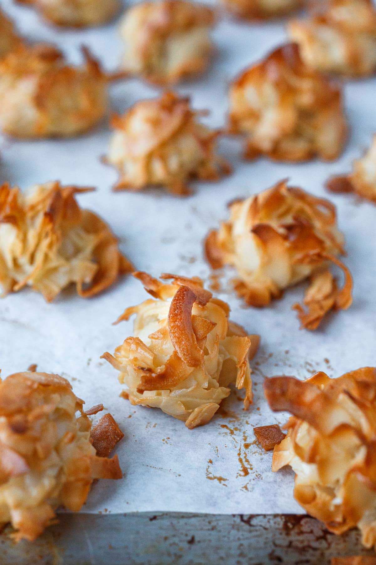 Baked macaroons on a sheet pan.