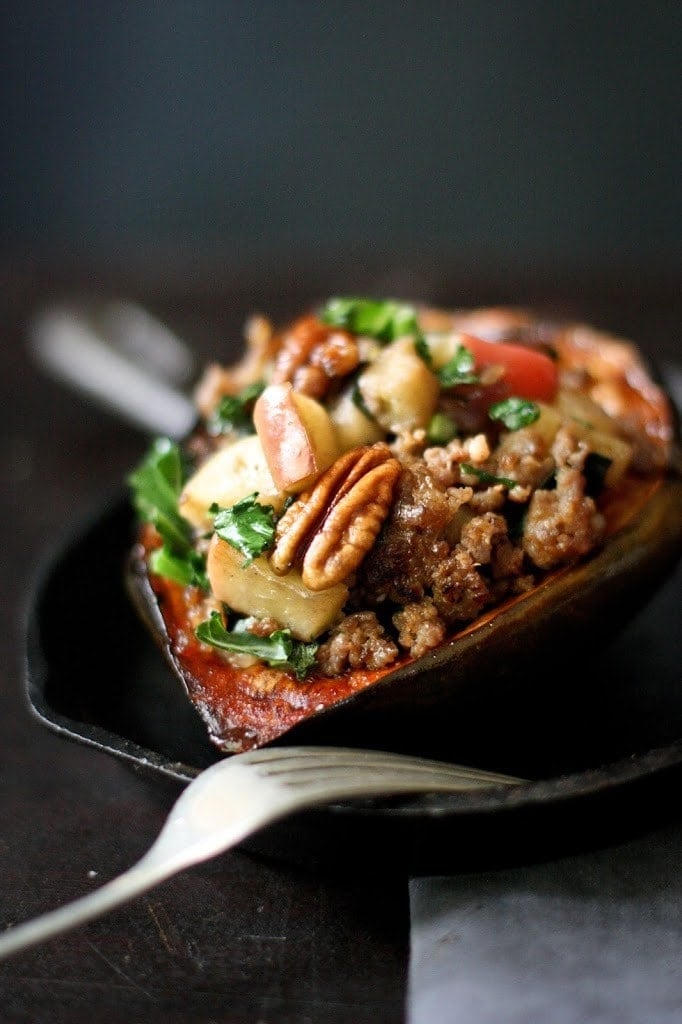 Roasted Acorn Squash with sausage, apple, parsnips, pecans and sage. Vegan-adaptable! 