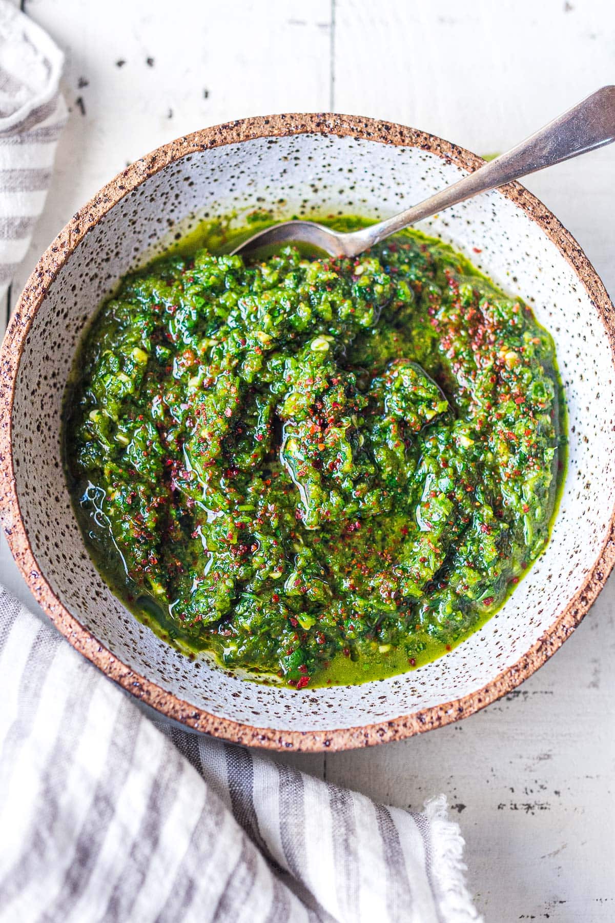 This authentic Zhoug recipe is full of spicy, punchy flavor! A popular Middle Eastern condiment, zhoug sauce is made with fresh cilantro, jalapenos, garlic, cardamom and cumin. Includes a video. 