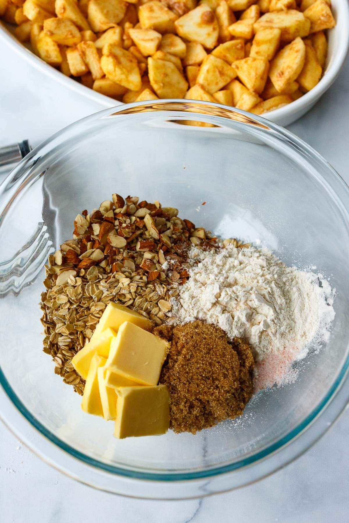 butter, oats, almonds, flour, brown sugar, salt in mixing bowl