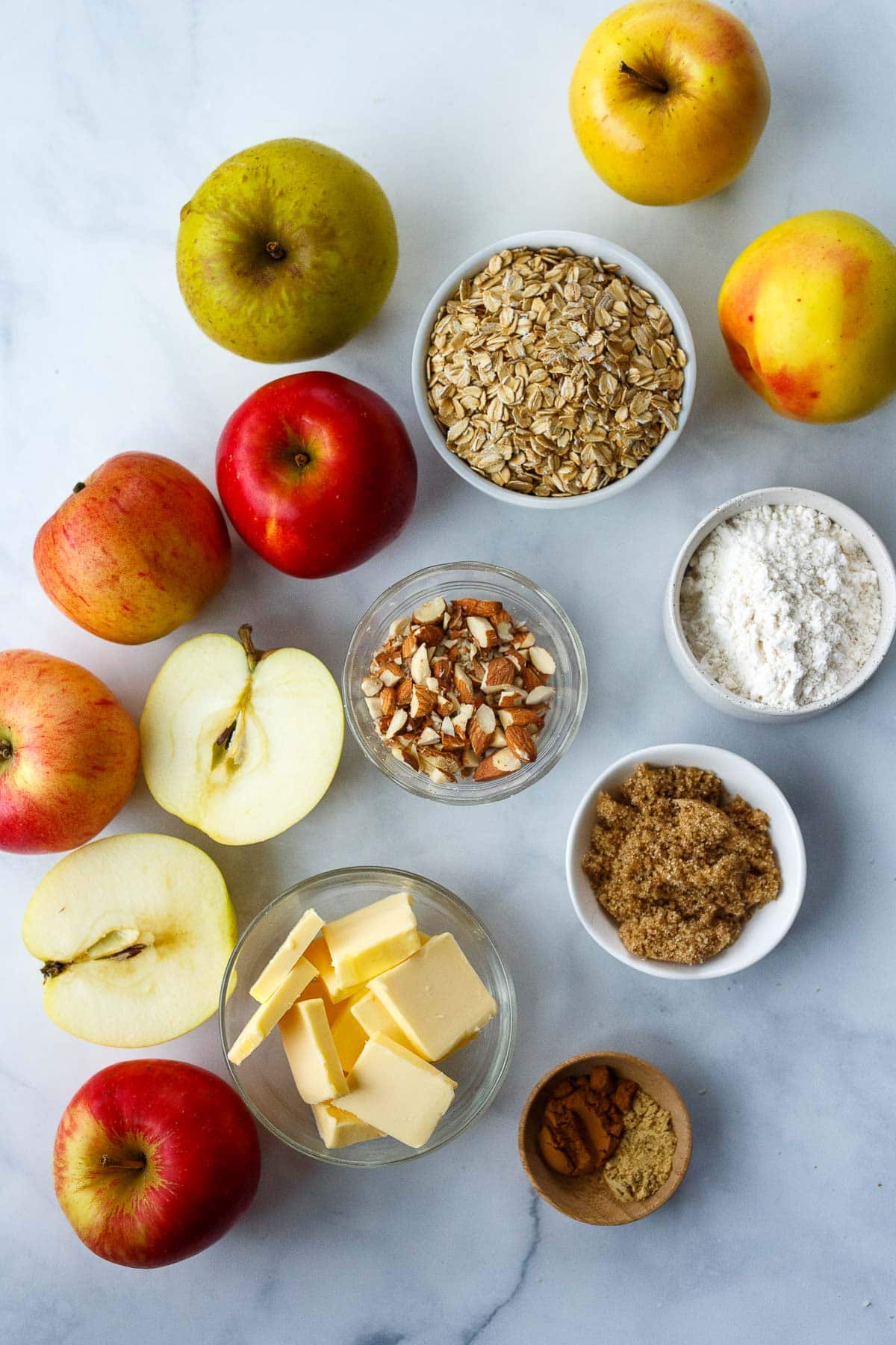 apple crisp ingredients - apples, oats, almonds, flour, sugar, butter, spices