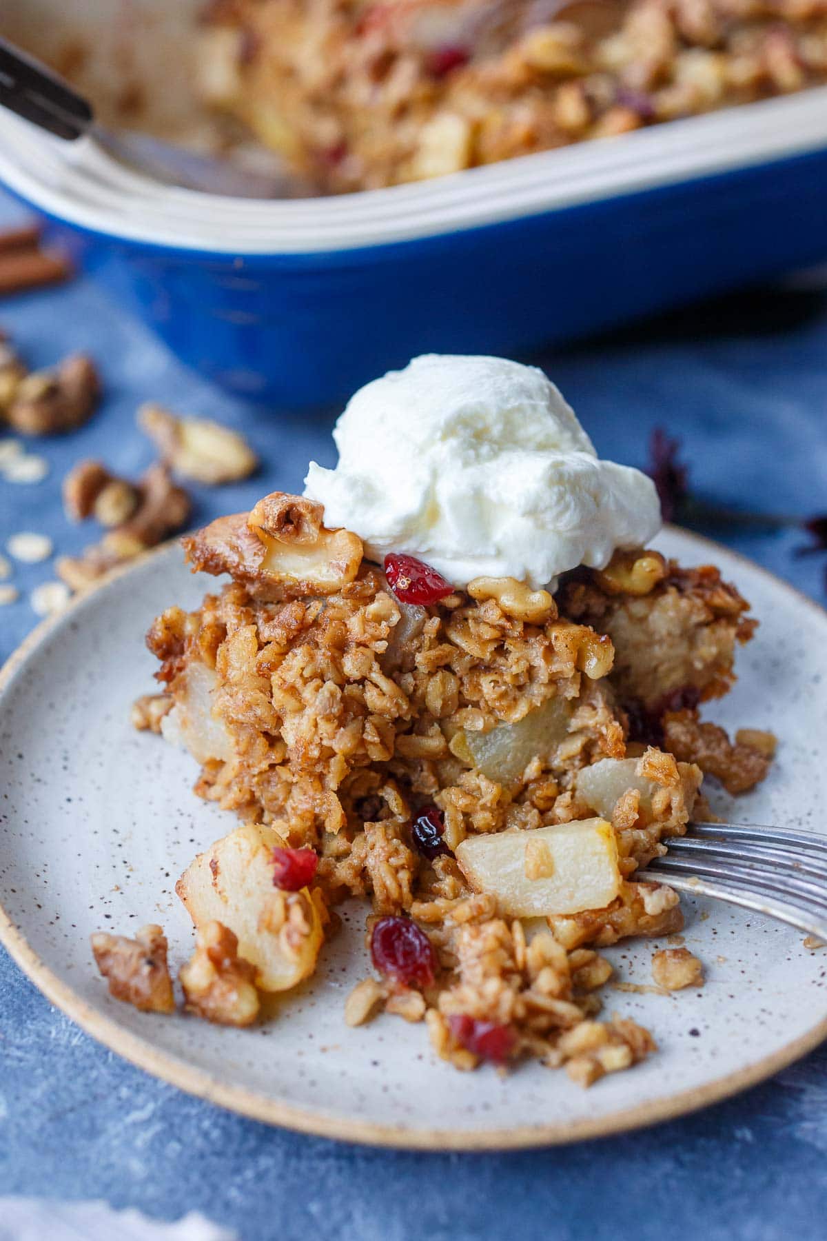 piece of baked oatmeal on plate with scoop of Greek yogurt
