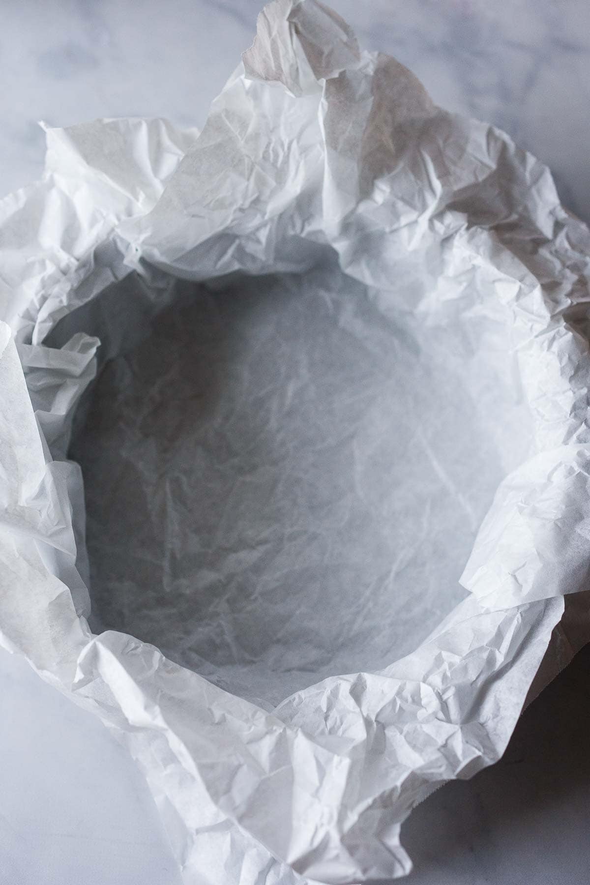 parchment paper crumpled and placed inside springform pan