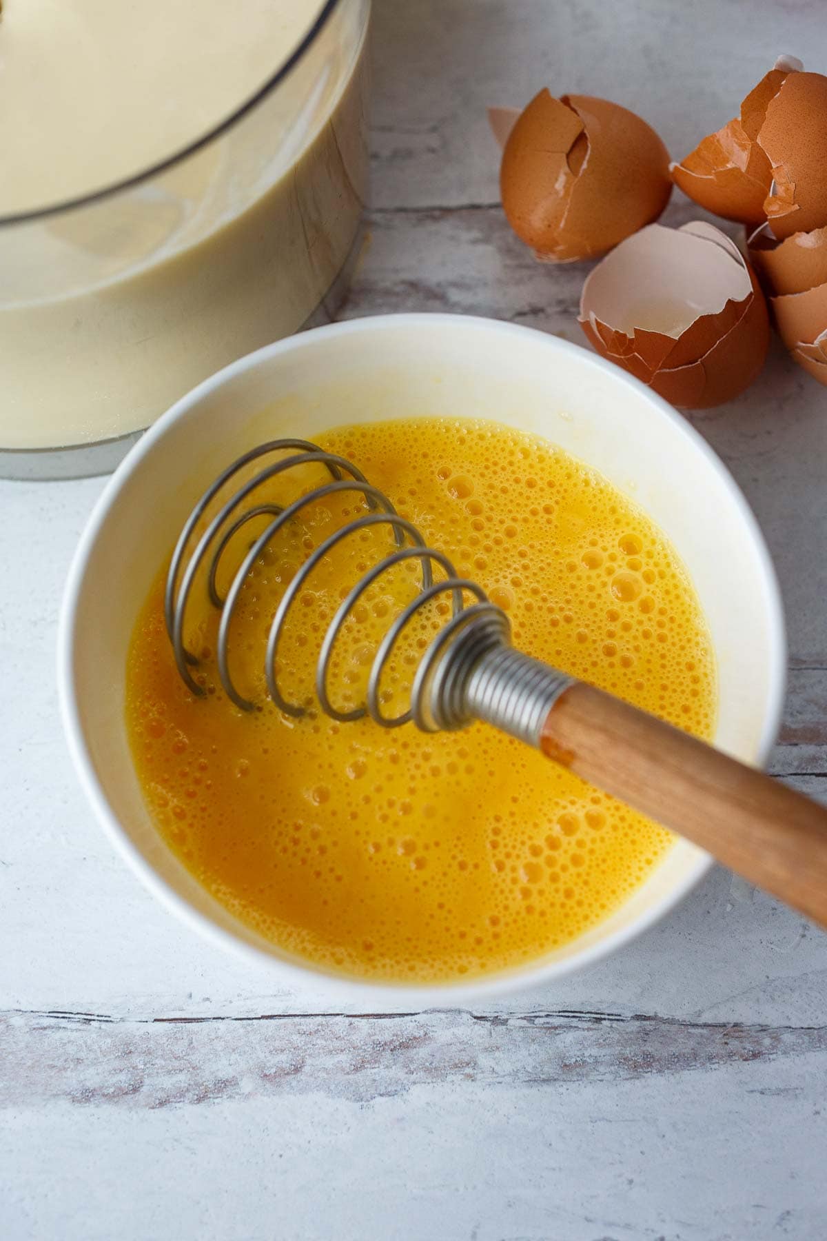 whisking eggs in small bowl