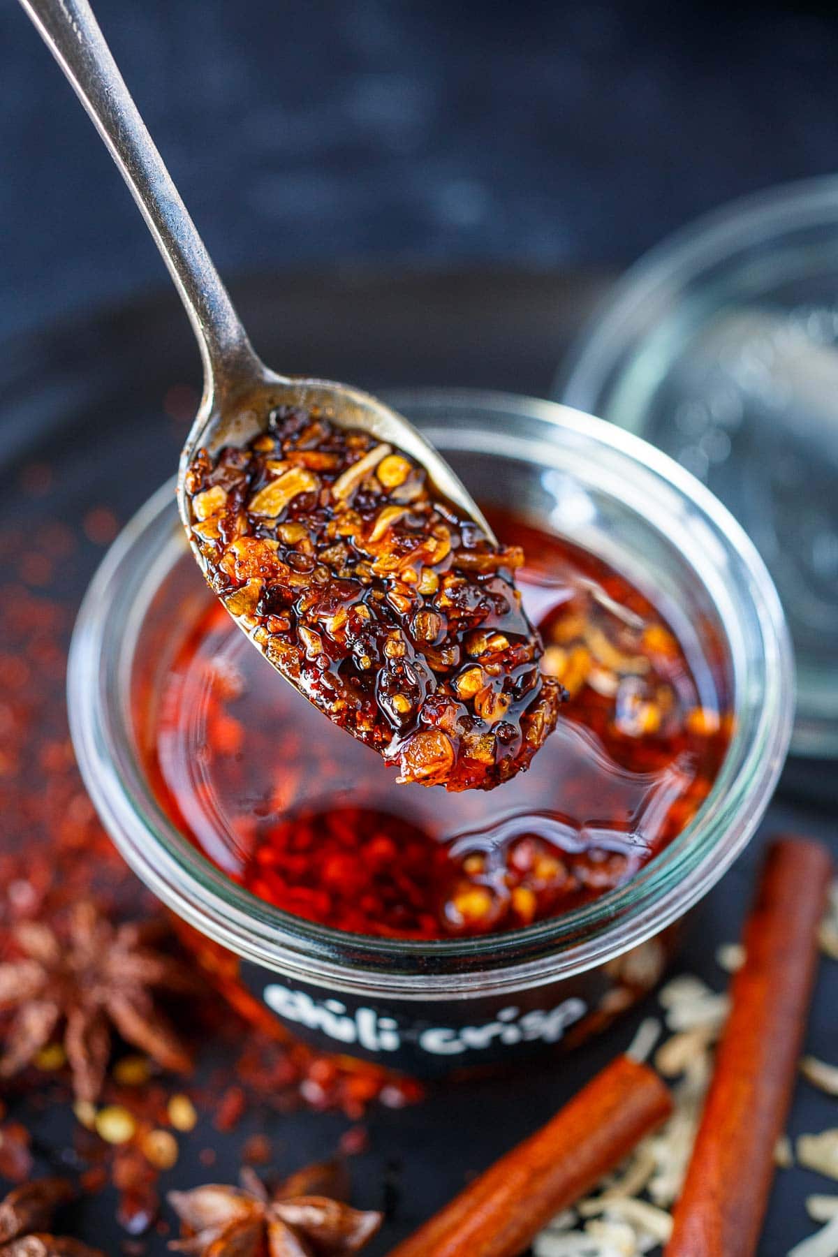 spoonful of chili crisp above jar