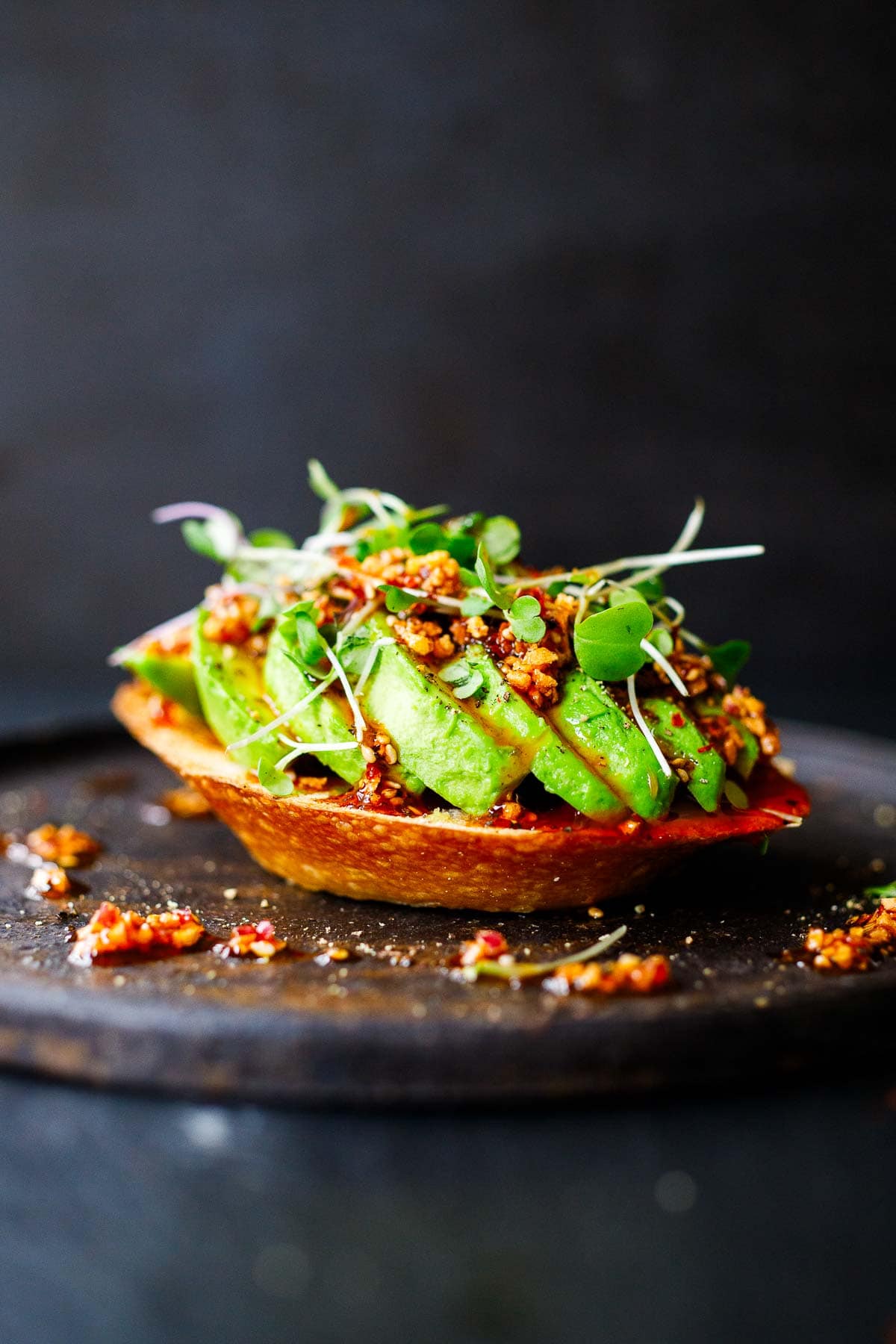 Ways to use chili crisp: Make Avocado Toast! Elevated with homemade Chili Crisp drizzled over top.