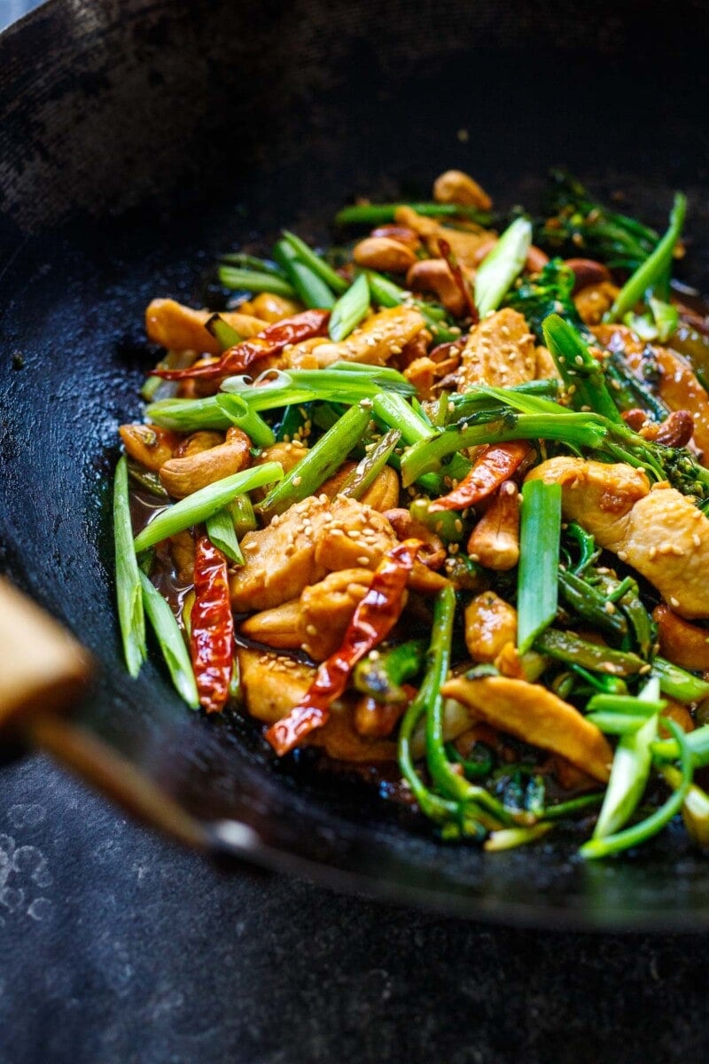 This Szechuan Chicken Stir fry is fast and flavorful! Made in under 30 minutes, with Szechuan (Sichuan) peppercorns, dried red chilies, thinly sliced chicken, and your choice of veggies!