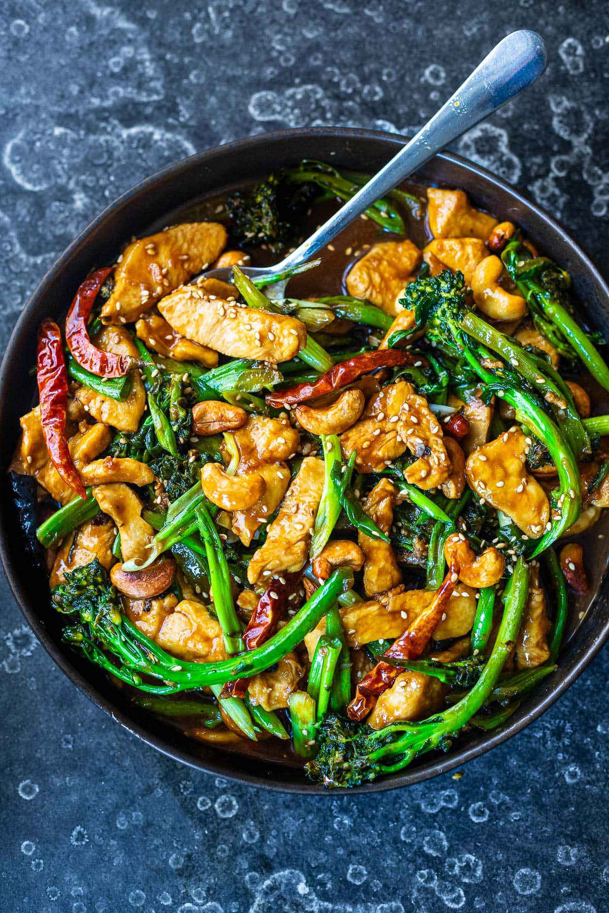 szechuan chicken with stir fry vegetables, toasted cashews, sauce, sesame seeds