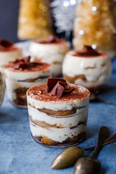 This Tiramisu recipe is deliciously creamy and easy, made with lady fingers soaked in coffee and Kahlua, layered with whipped mascarpone (no raw eggs), dusted with dark cocoa powder and sprinkled with bittersweet chocolate curls.