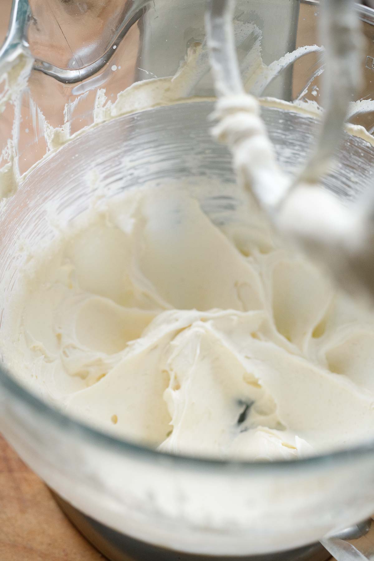 mascarpone and whipped cream mixed together in mixing bowl