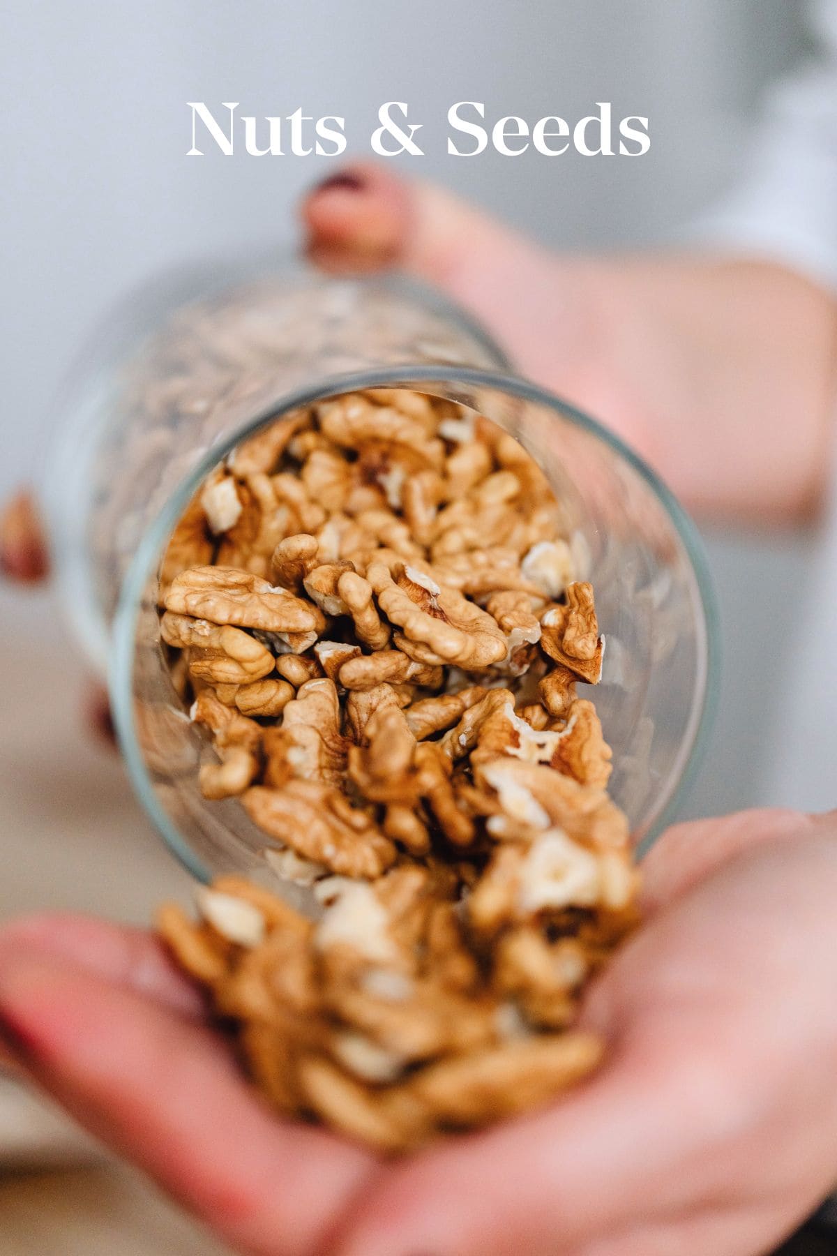 walnuts pouring out of a jar. 