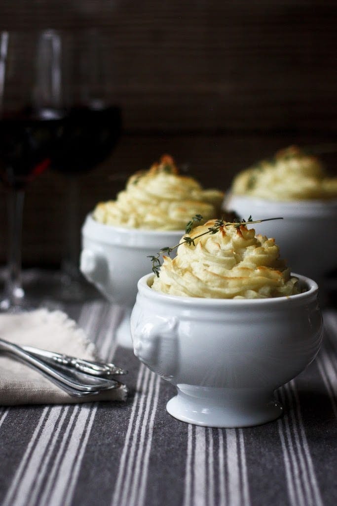 Vegan Shepherds Pie with mushrooms and root vegetables- topped with pillowy mashed potatoes. A delicious vegan main dish -perfect for the holiday table. #sheperdspie #vegan