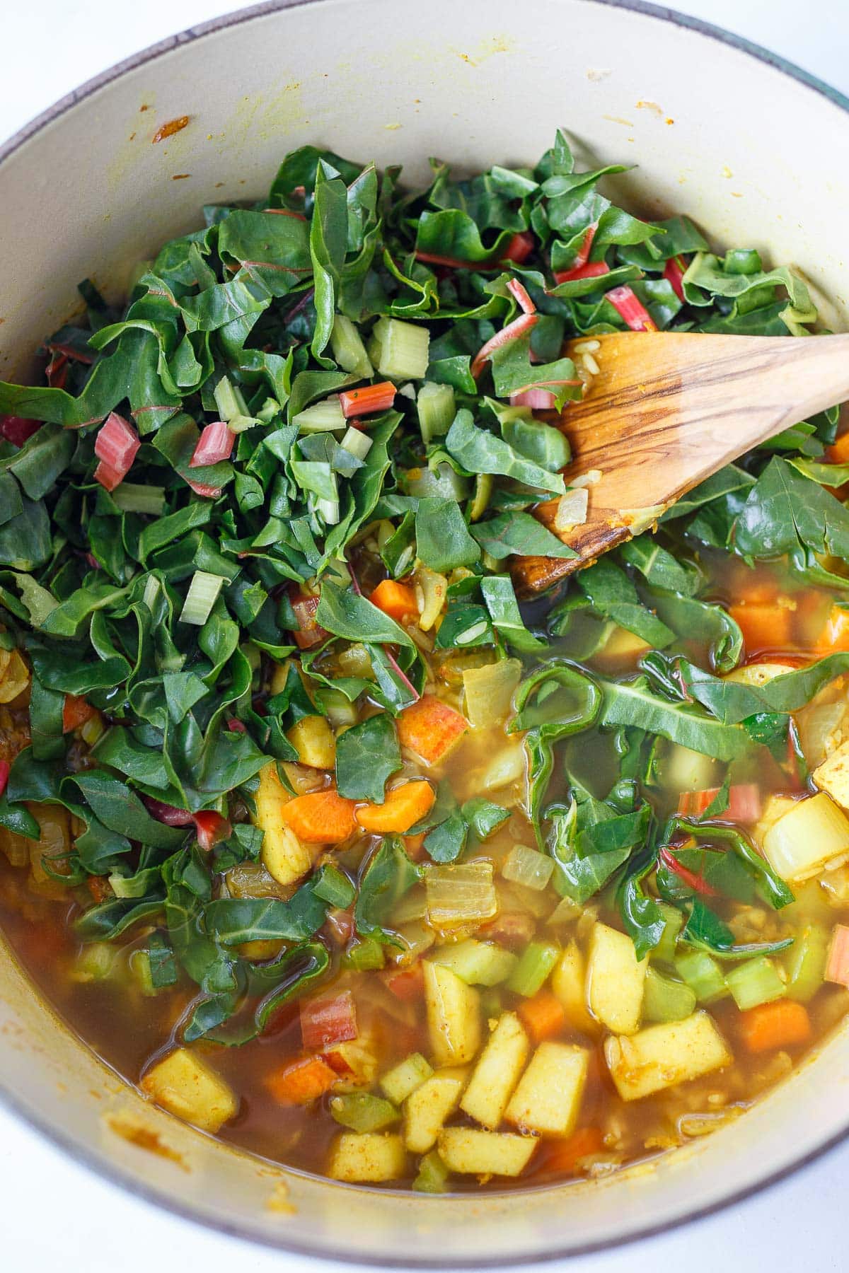 soup pot simmering with sliced chard mixed in.