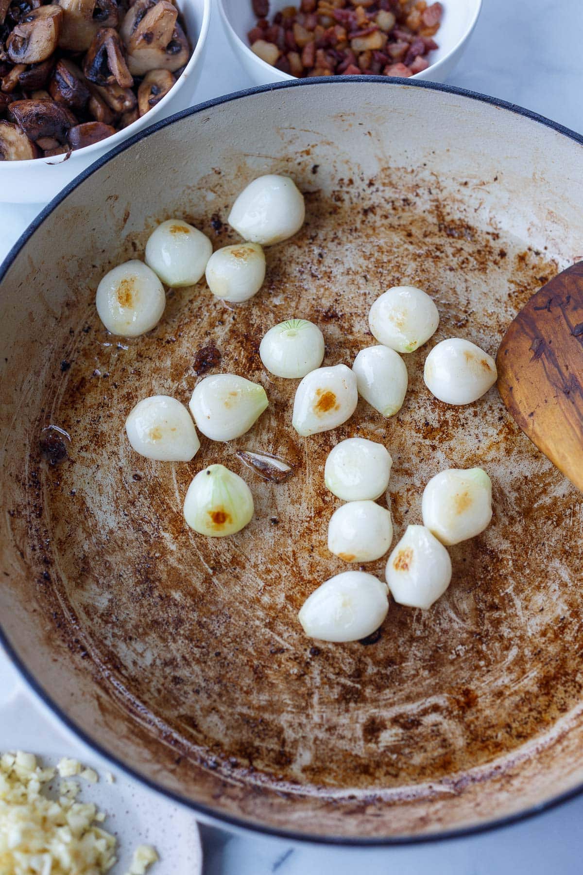 pearl onions sautéing in pan.