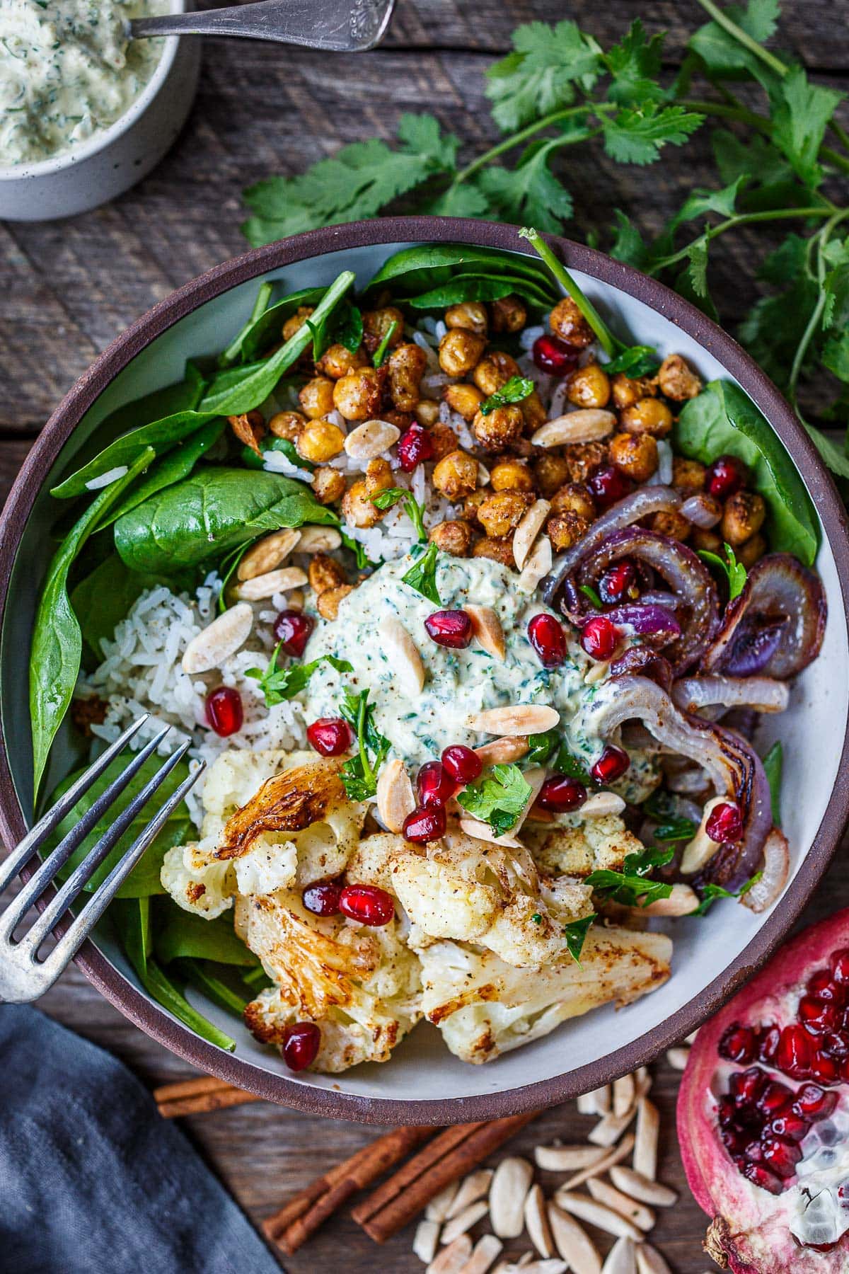 Cauliflower Chickpea Bowls served over Moroccan rice with spinach, almonds.