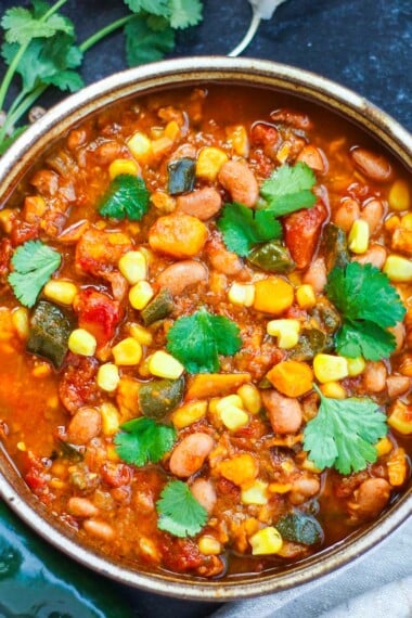 Wholesome, hearty and flavorful this Pinto Bean Stew is quick to throw to together and perfect for fall and winter weeknight dinners.  Instant Pot or Stovetop version!