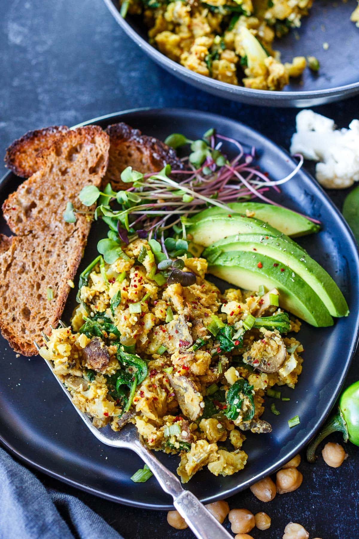 This Chickpea Scramble recipe (vegan scrambled eggs) is so savory and delicious! A protein-rich breakfast that is easy to make- egg-free, dairy-free, soy-free, and gluten-free!