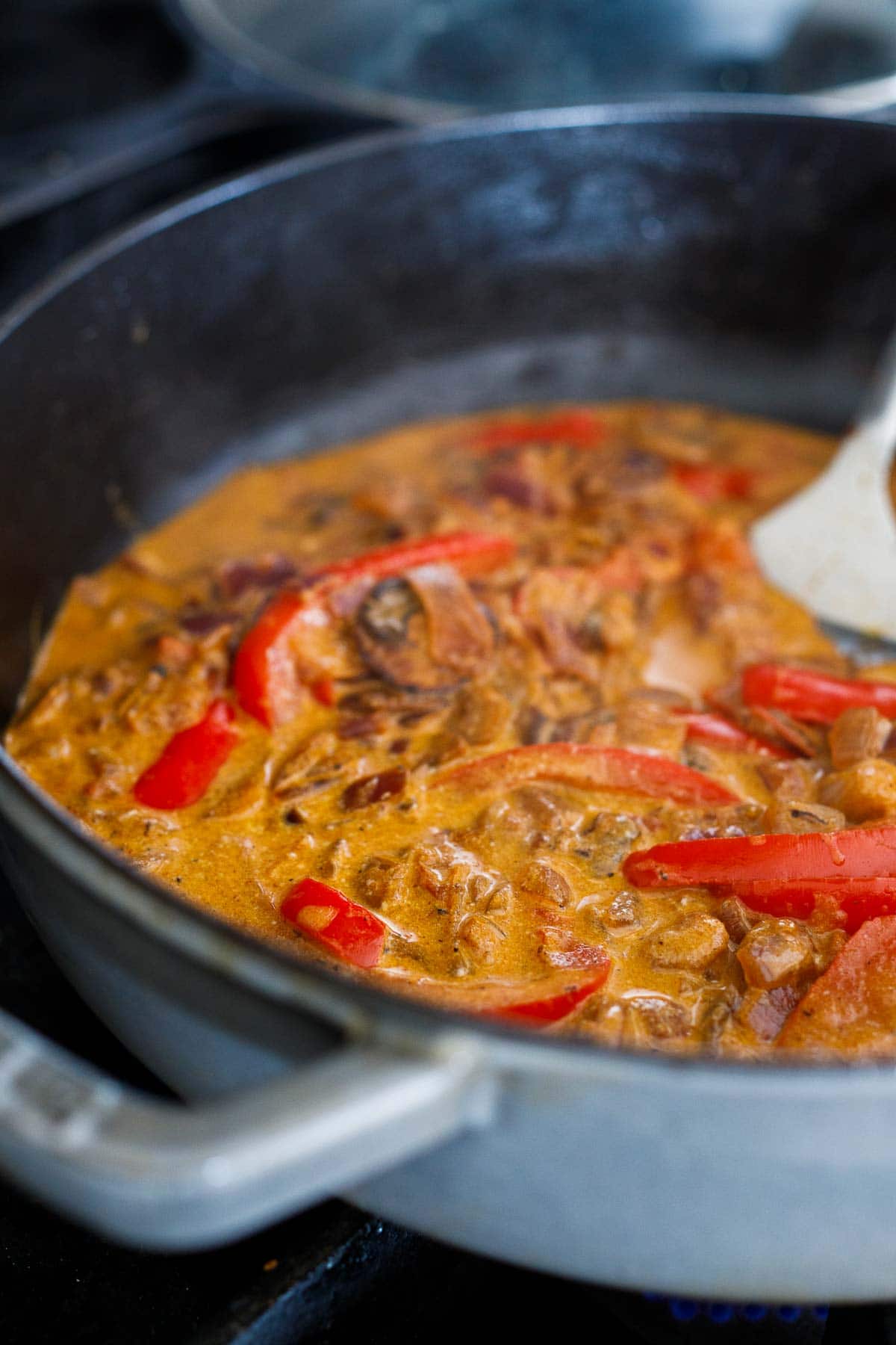 creamy paprikash sauce simmering in pan.