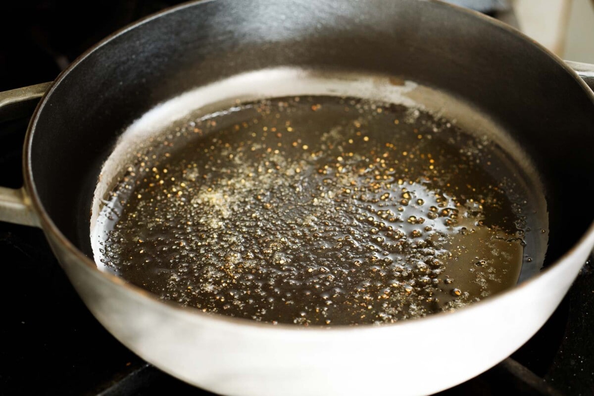 olive oil, salt, and pepper in skillet simmering.
