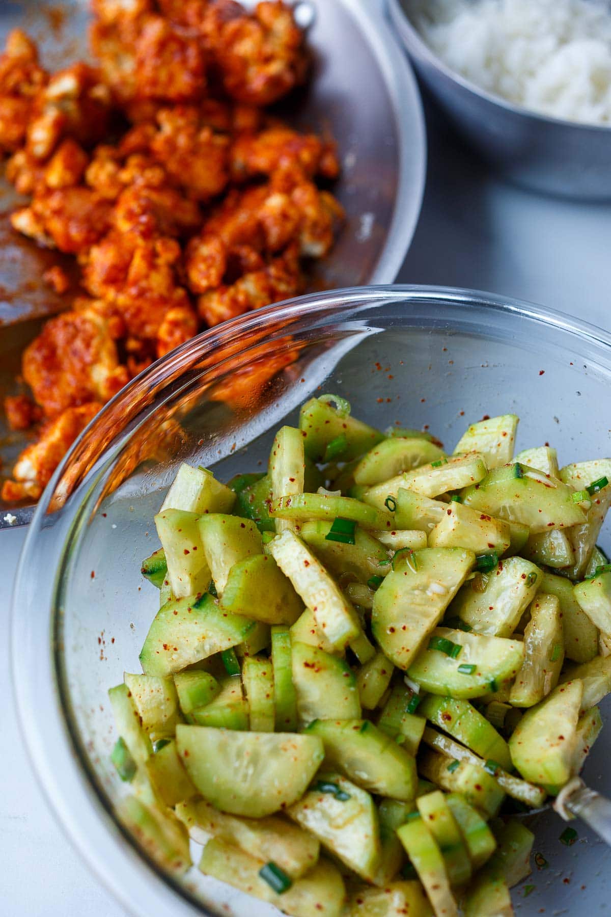 Korean cucumber salad in mixing bowl.