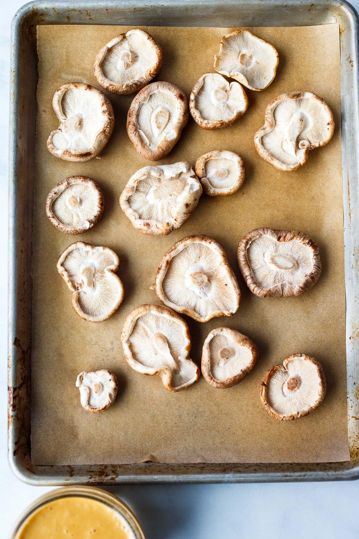 Shiitake mushrooms on a sheet pan.
