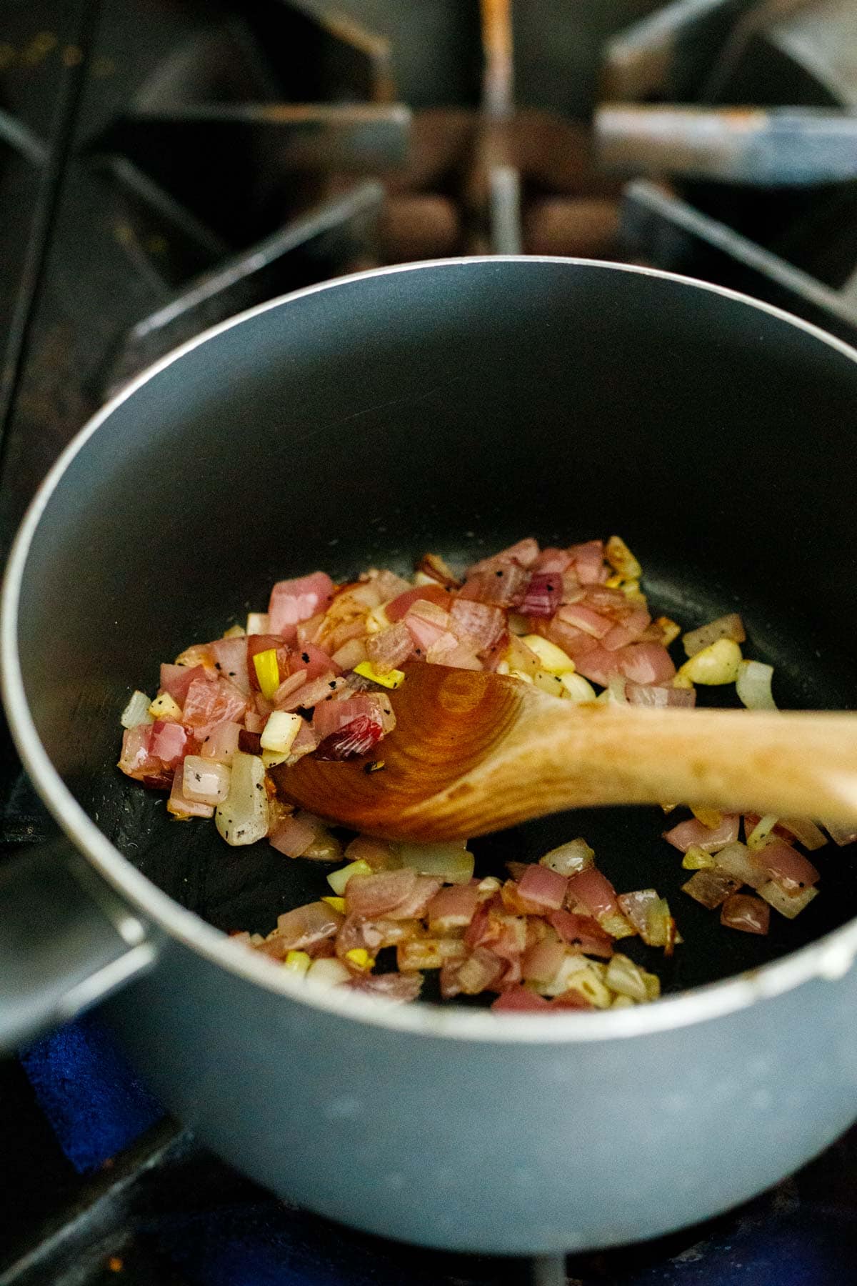 shallot and garlic sautéing in pot.