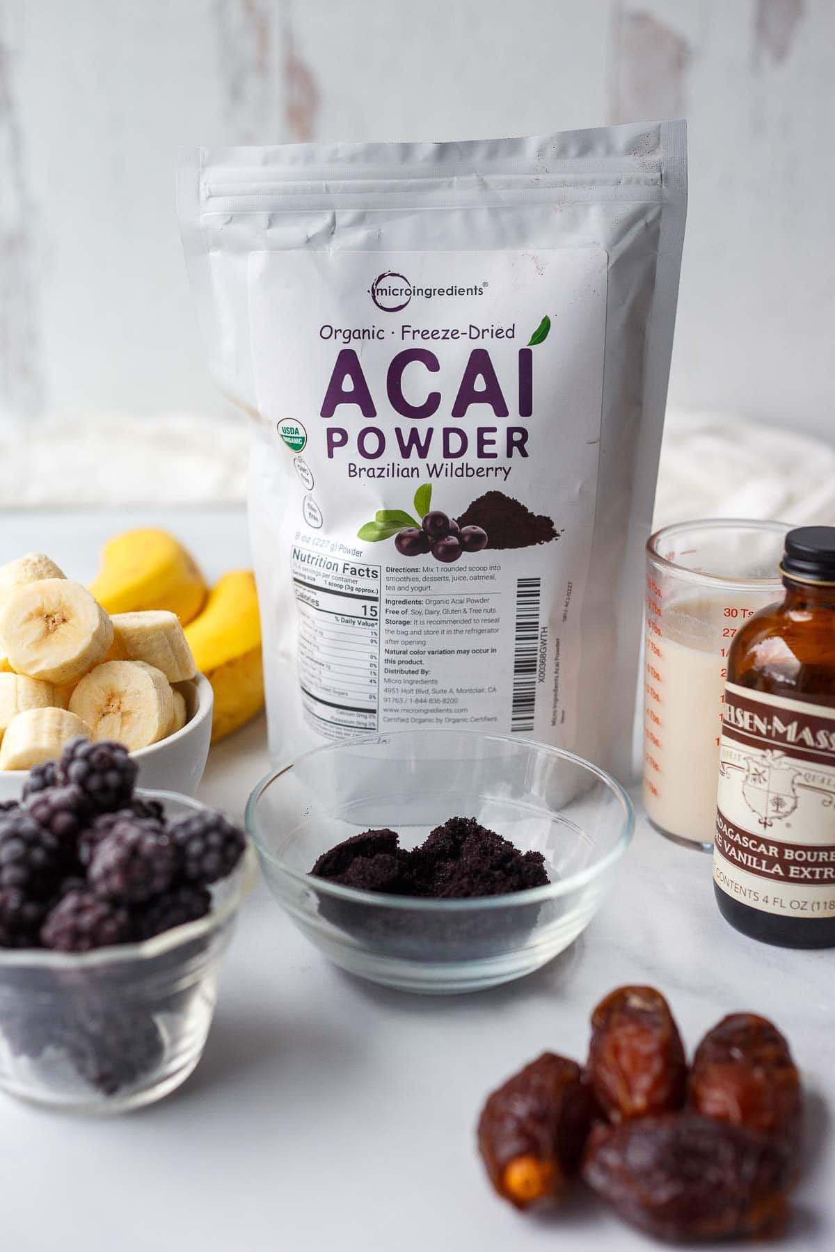 ingredients for acai bowls- organic freeze-dried acai powder, bananas, blackberries, milk, dates.