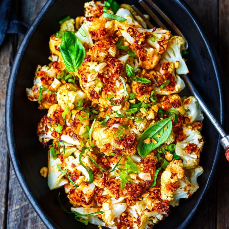 Golden and delicious roasted Chili Crisp Cauliflower is a fast and easy side dish or tasty appetizer with loads of flavor and crispy crunchy texture.