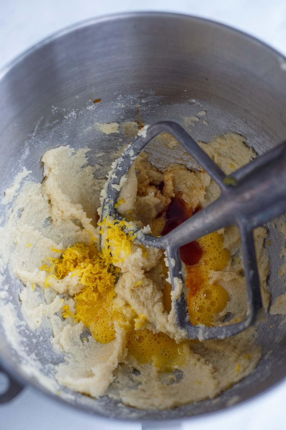 stand mixer, mixing lemon cookie batter with zest, egg, vanilla.