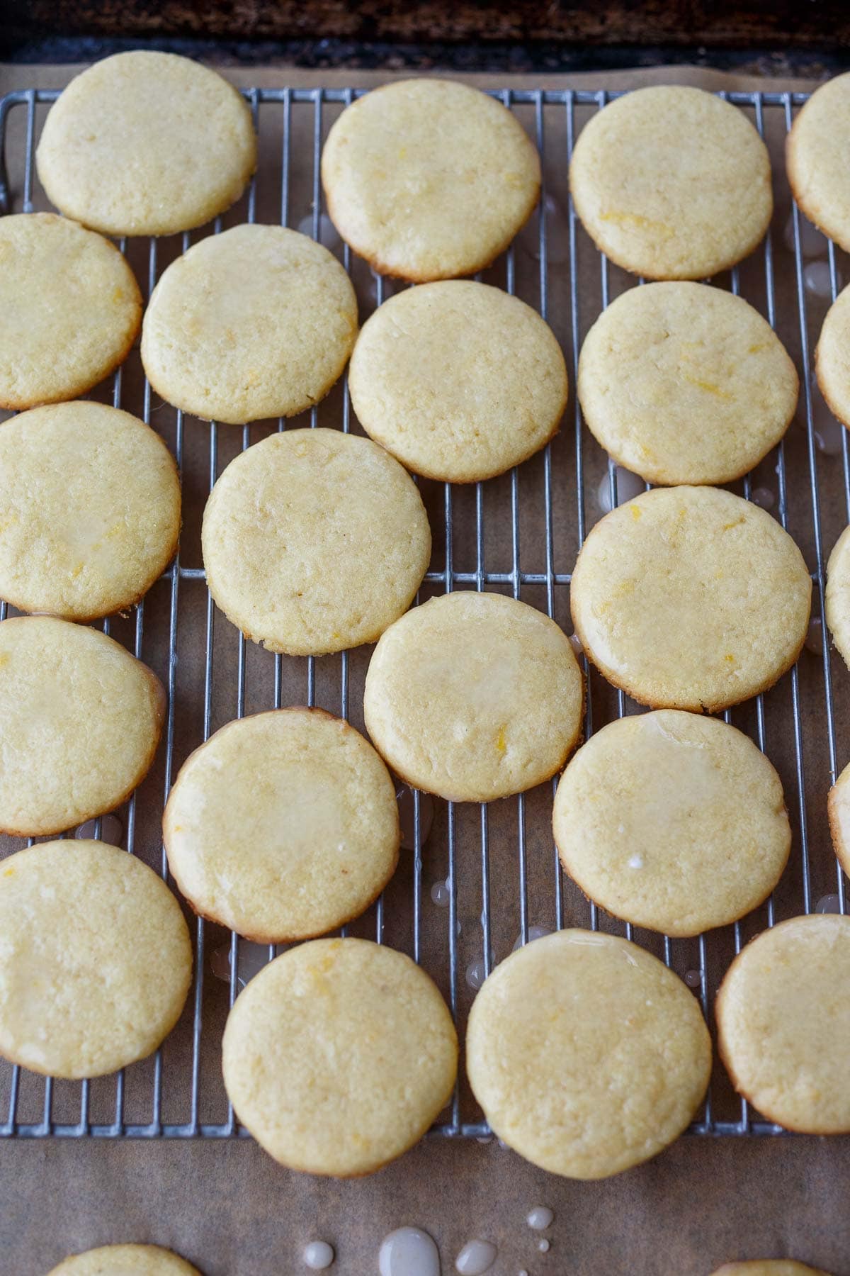 lemon cookies on cooling rack, drizzled with lemon glaze.