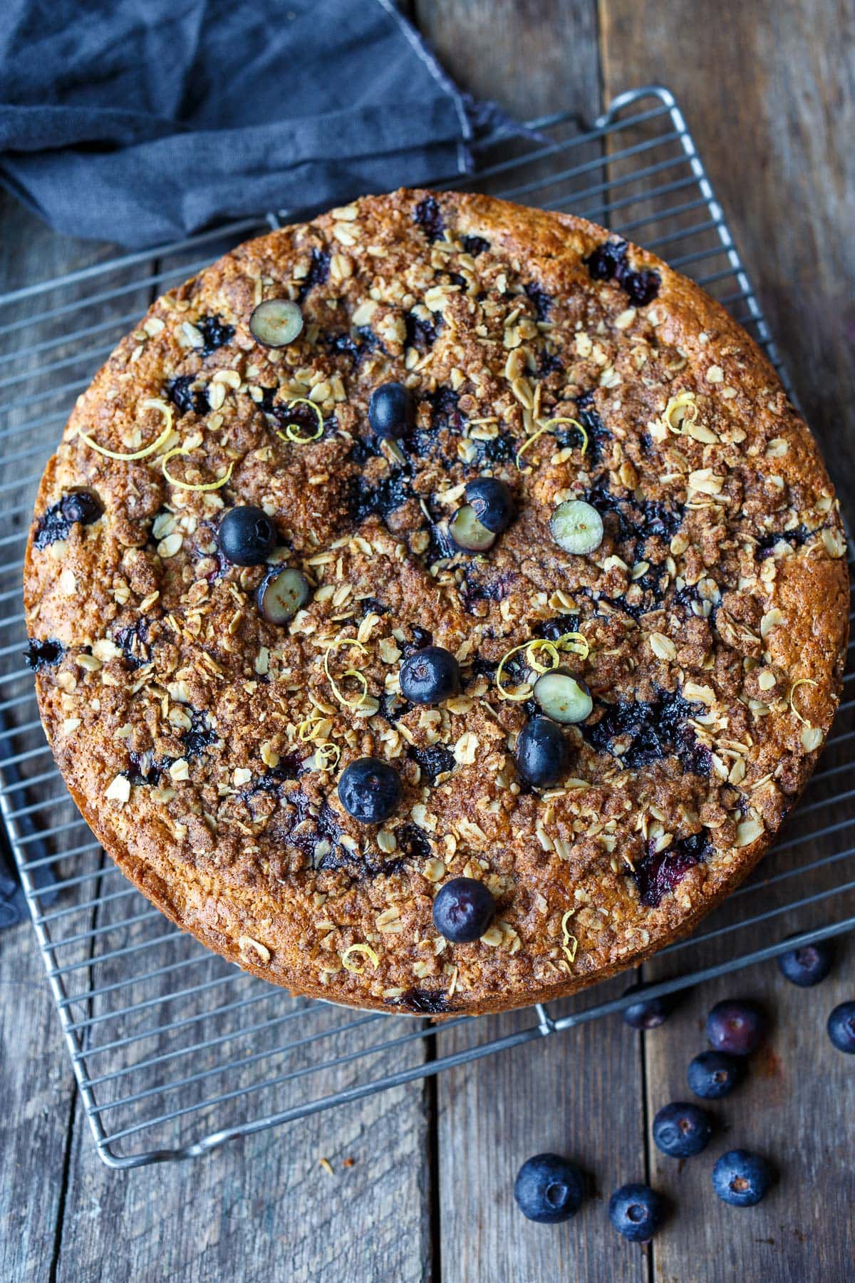 Blueberry coffee cake on a cooling rack. 