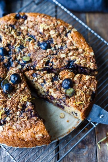 A deliciously tender Blueberry Coffee Cake with hints of cinnamon, lemon and a crunchy oat crumble topping.